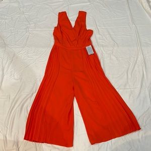 Adelyn Rae Orange Jumpsuit. Size small! New with tags.